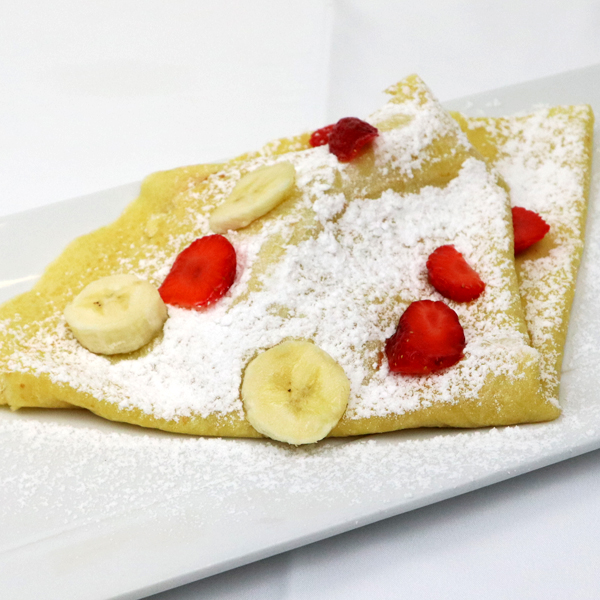 Crepes, cream with strawberry and banana